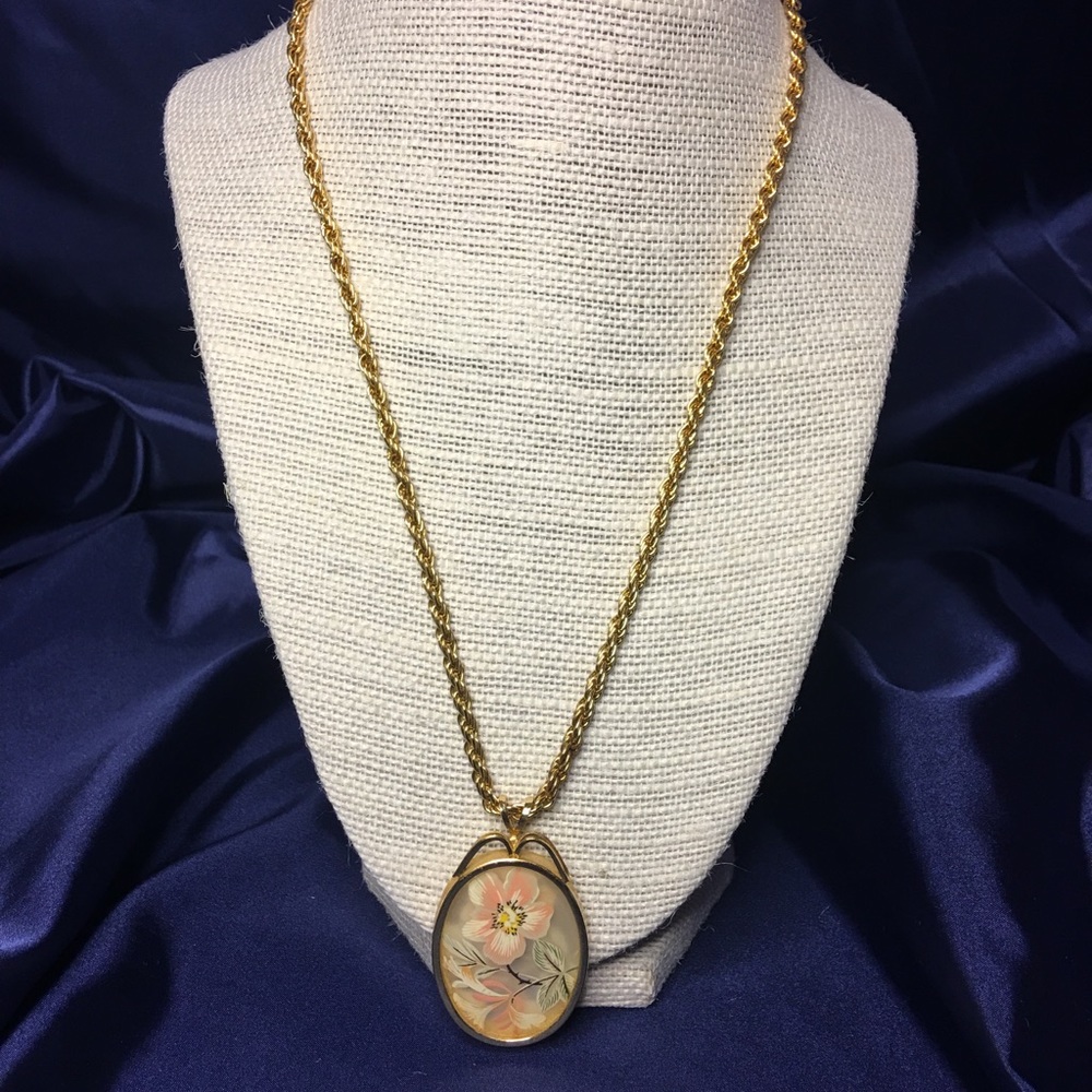 Gold flower locket style necklace
